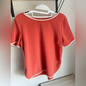 orange top with white detail